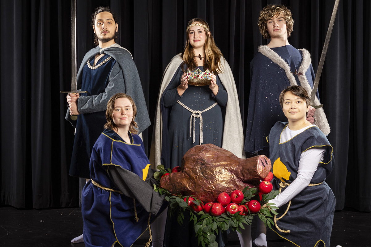 Guests will be welcomed to the Madrigal Feast by performers in period costumes like the following. From left to right standing are Keithan Diaz, Leah Ashcroft, and Stuart Terbeek, with M.J. Olson and Miles Soriano kneeling. 