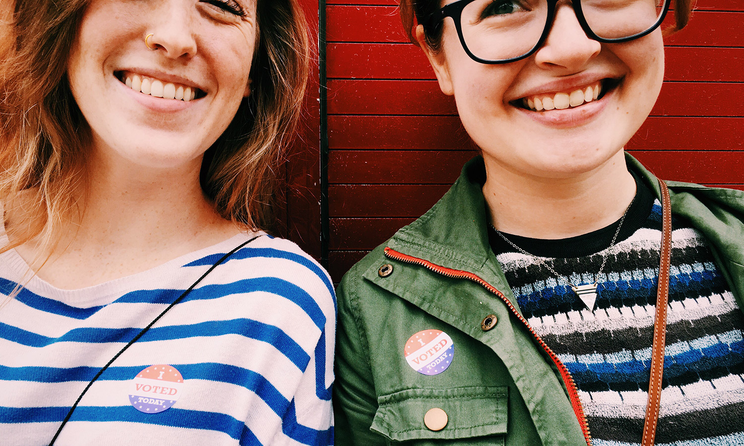 Two young women vote