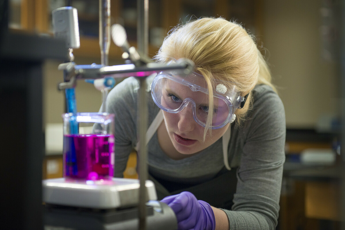 Researcher in lab conducting an experiment.