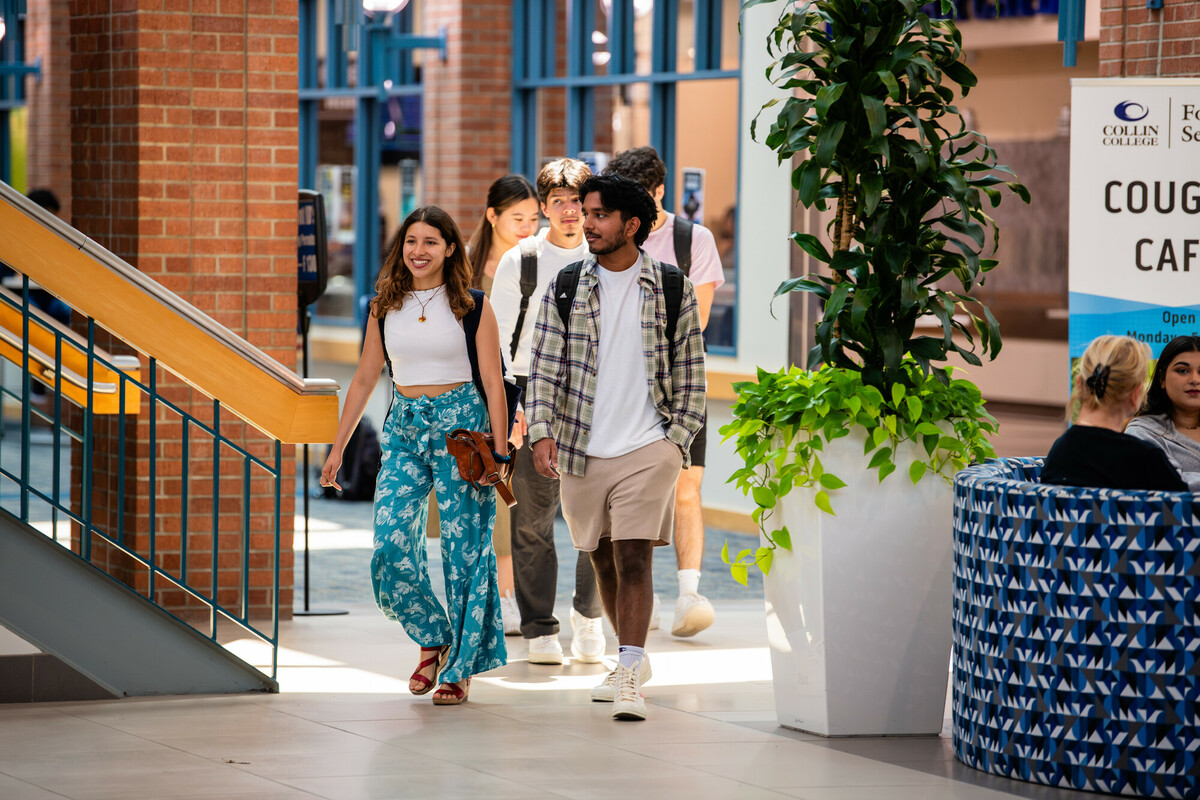 Collin College students walking across campus