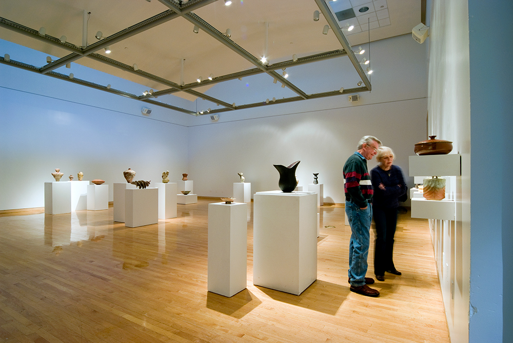 Patrons enjoying an exhibition at The Art Gallery at Collin College