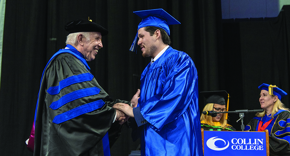 Founding Board of Trustees member Dr. Collins proudly congratulating a student at graduation, an event in which he has participated for decades.