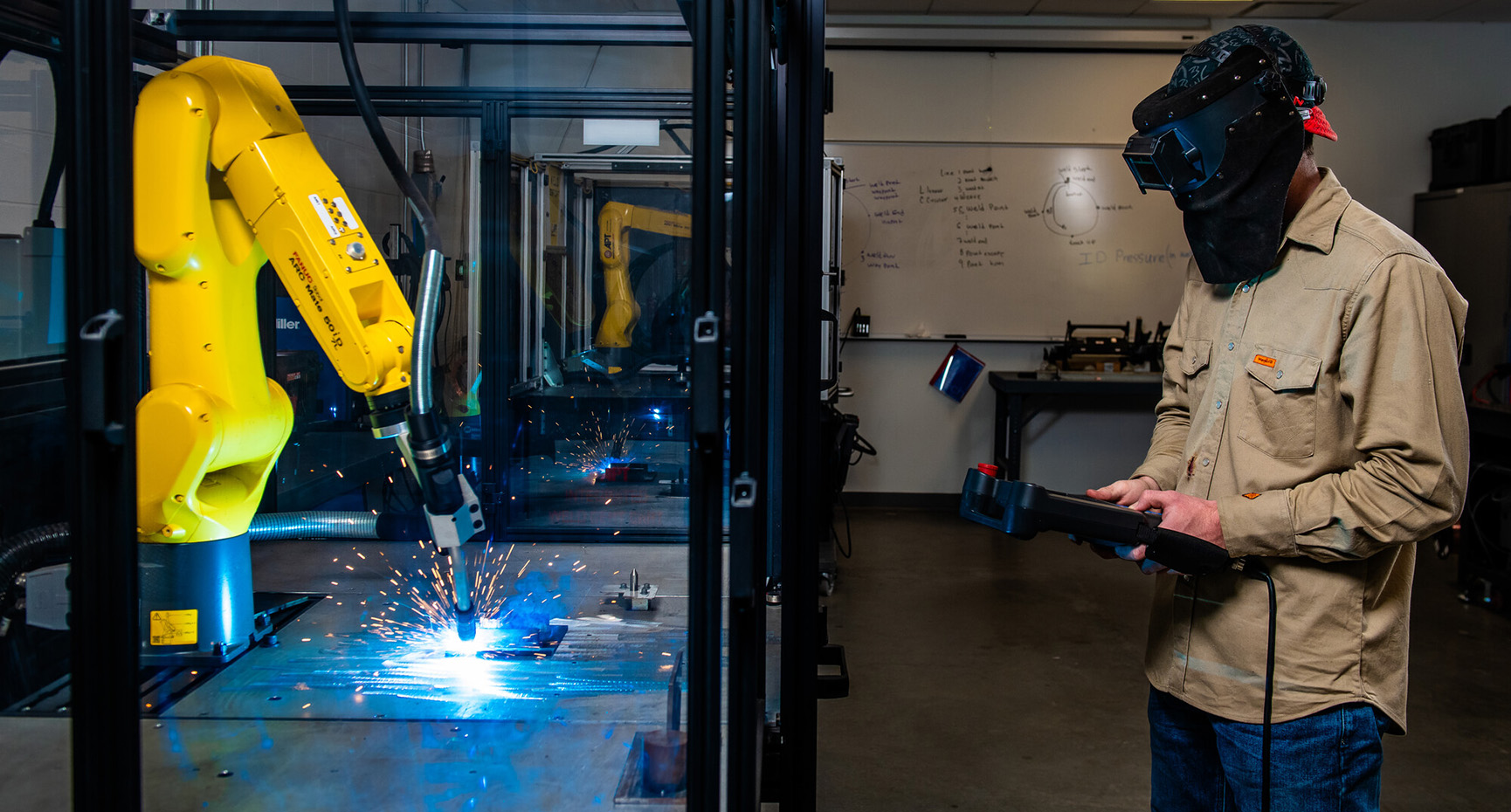 Wyatt Jordan, a welding student at Collin College Technical Campus, practices using the campus’s current automated welding machinery.