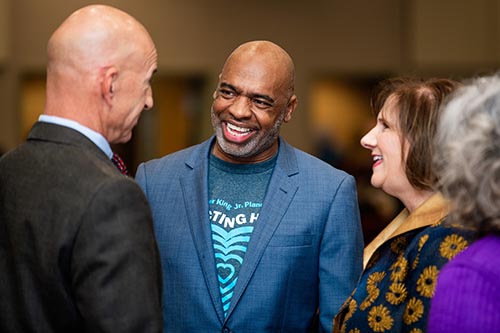 Dr. Albert Tezeno (center) has a conversation with Texas representatives Matt Shaheen and Candy Noble at the Dr. Martin Luther King Jr. Power Leadership Breakfast on Jan. 18.  Dr. Tezeno is the co-chair of the annual event that celebrates Dr. King’s legacy. 