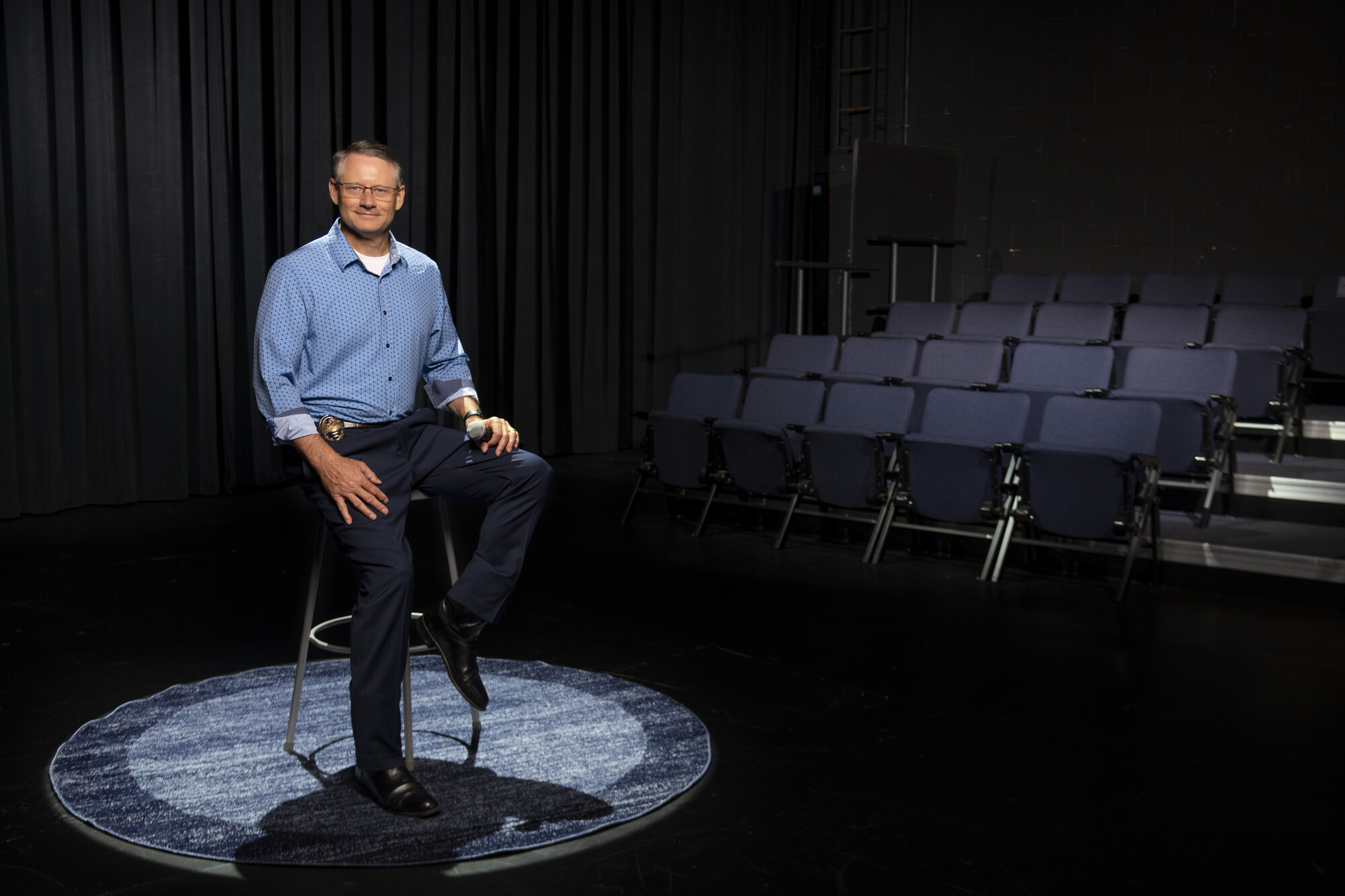 chief siting in chain, large room