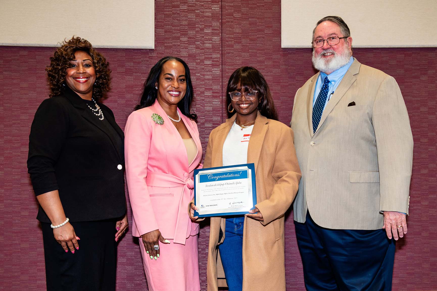 (From left) Alpha Kappa Alpha Chi Omega Chapter President Saron Brown, Pearls of Service President Dr. Traci Gardner-Petteway, scholarship winner Iteoluwakishipop Osinoiki-John, and Dr. Neil Matkin, president of Collin College, pose for a picture during the Dr. Martin Luther King Jr. Power Leadership Breakfast on Jan. 18. The annual event celebrates Dr. King’s legacy and has been held in cooperation with Collin College since 1992.