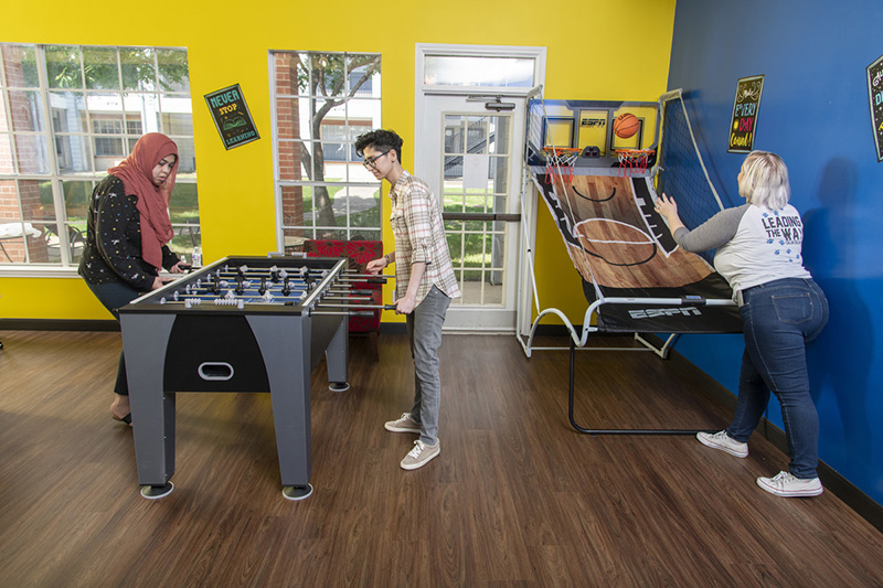 Residents playing fooseball in Student Housing