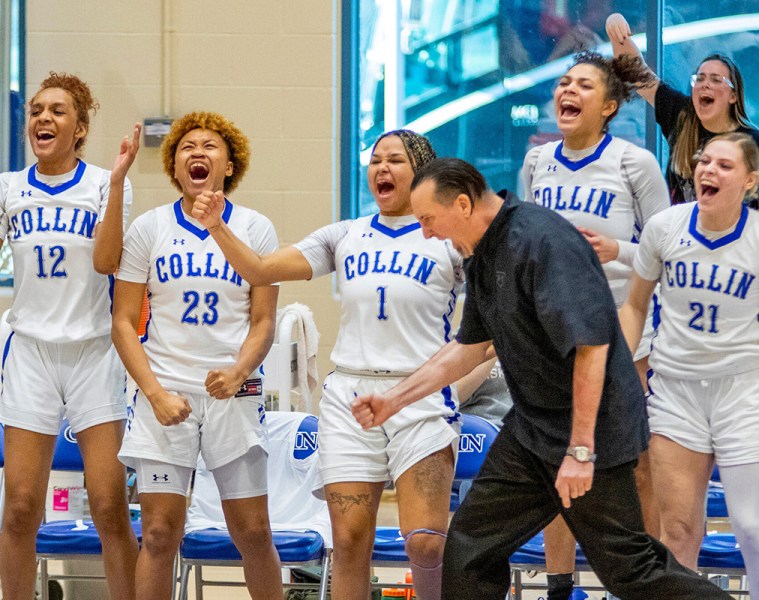 Collin College Lady Cougars team members and Coach Jeff Allen celebrate a clutch basket in a comeback win over McLennan Community College in January.
